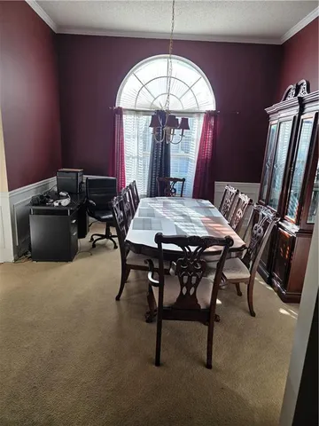 a view of a livingroom with furniture and window