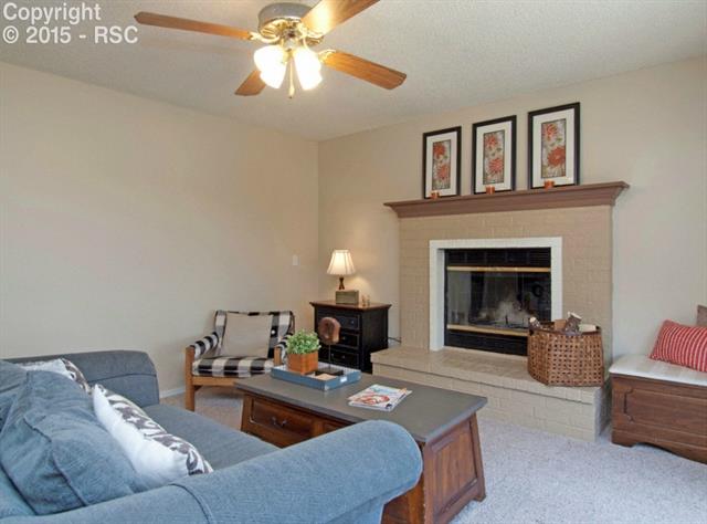 7831 Swiftrun Road Colorado Springs, CO 80920 - Photo 20 of 35 Neutral paint and upgraded carpet in family room
