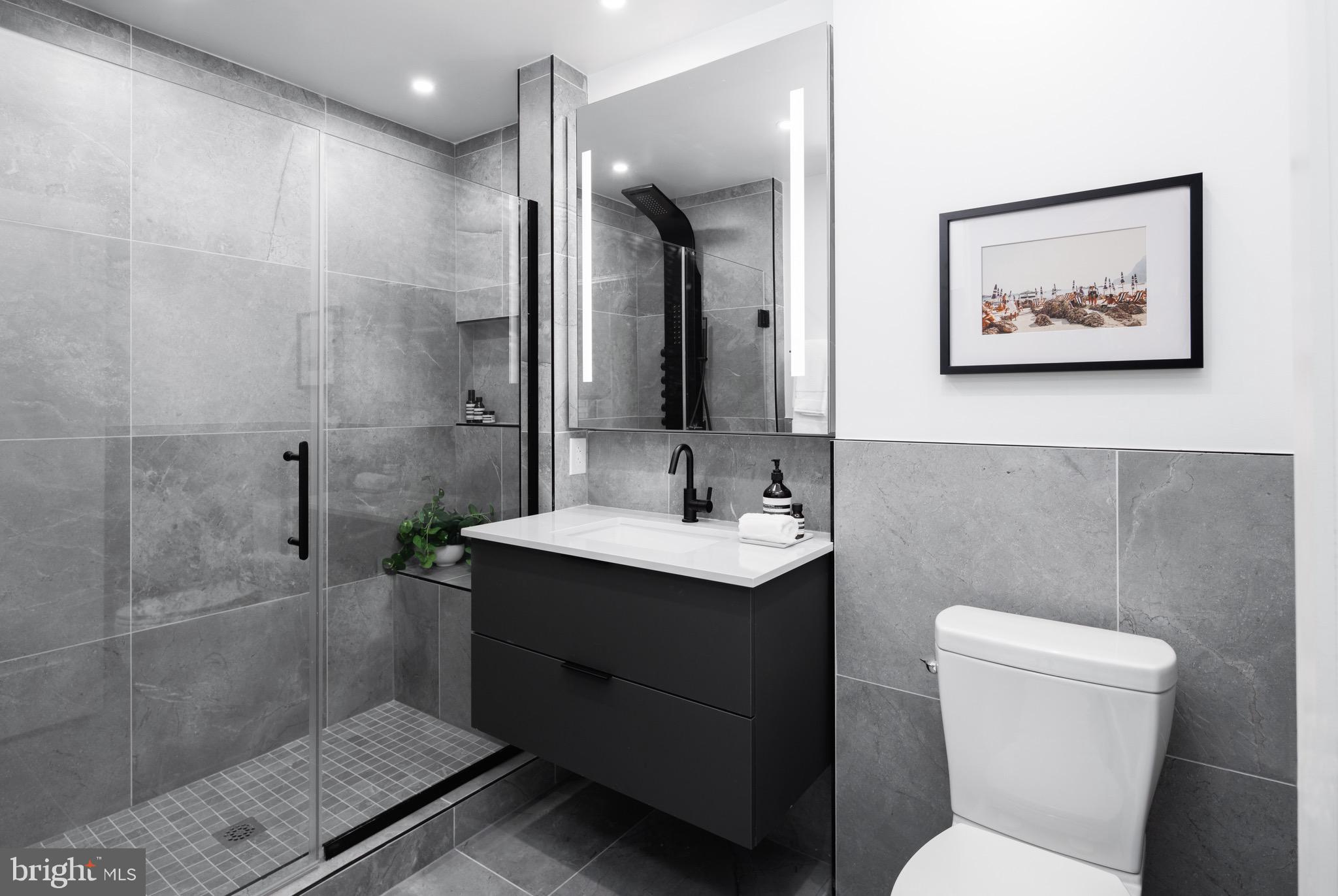 1099 Germantown Avenue, Unit A Philadelphia, PA 19123 - Photo 11 of 53 a bathroom with a toilet sink and mirror