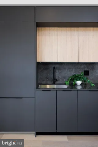 a kitchen with a sink and cabinets