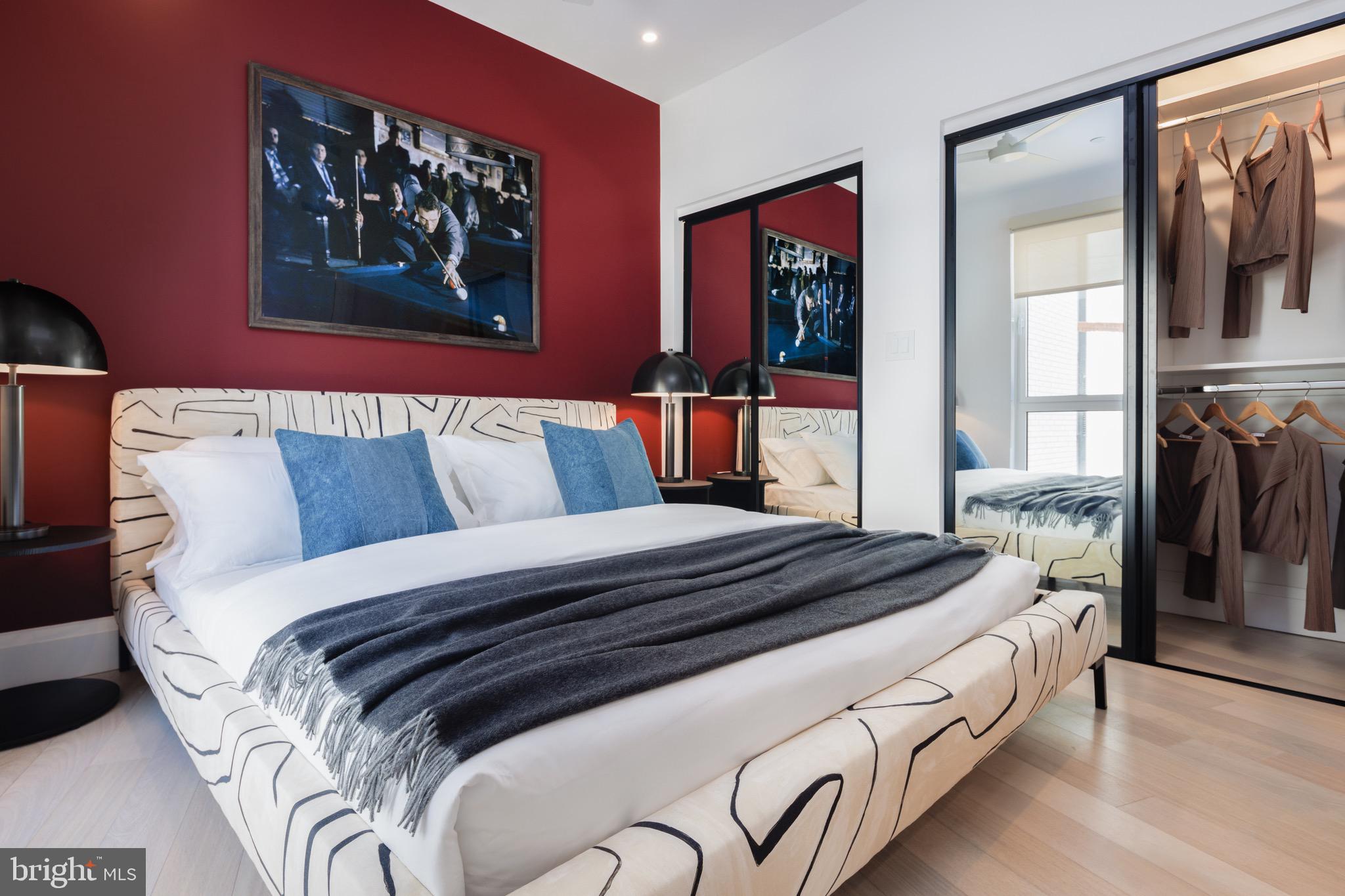 1099 Germantown Avenue, Unit A Philadelphia, PA 19123 - Photo 18 of 53 a bedroom with bed and wall painting on the wall