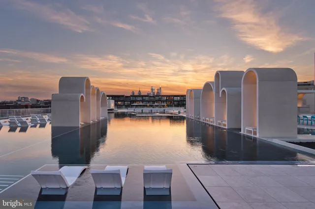 a view of swimming pool with outdoor seating