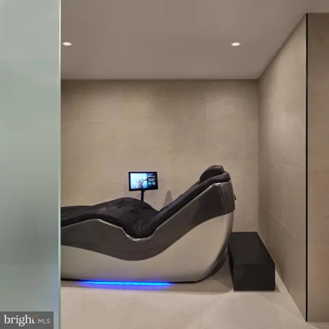 a view of a room with wooden floor and cabinet