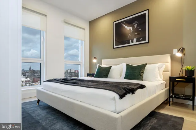 a bedroom with bed and window