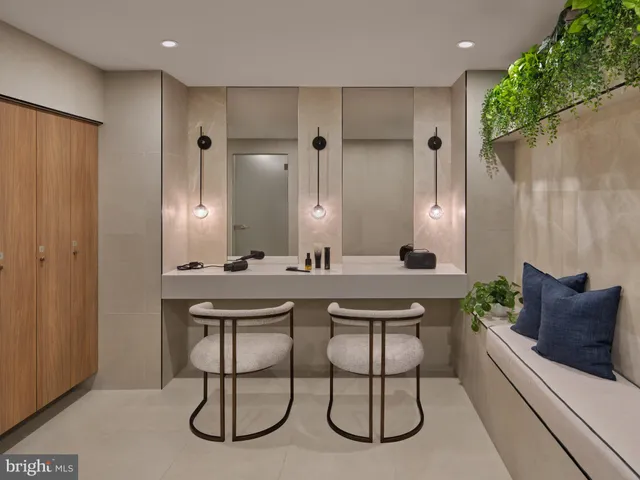 a large room with wooden floor and furniture