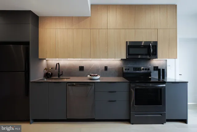 a kitchen with a sink and cabinets