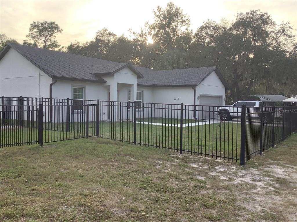 1150 North Dean Road Orlando, FL 32825 - Photo 1 of 16 a view of a backyard