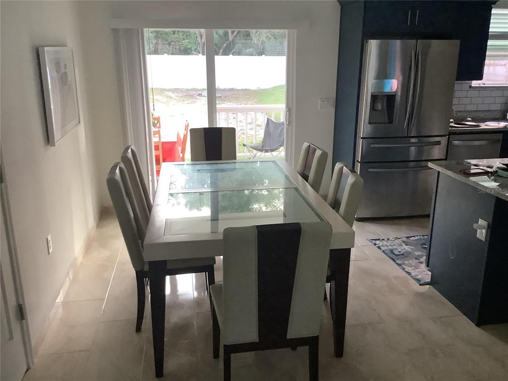 1150 North Dean Road Orlando, FL 32825 - Photo 11 of 16 a view of a dining room with furniture window and outside view