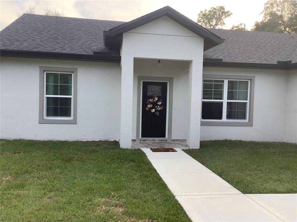 1150 North Dean Road Orlando, FL 32825 - Photo 3 of 16 a house view with a garden space