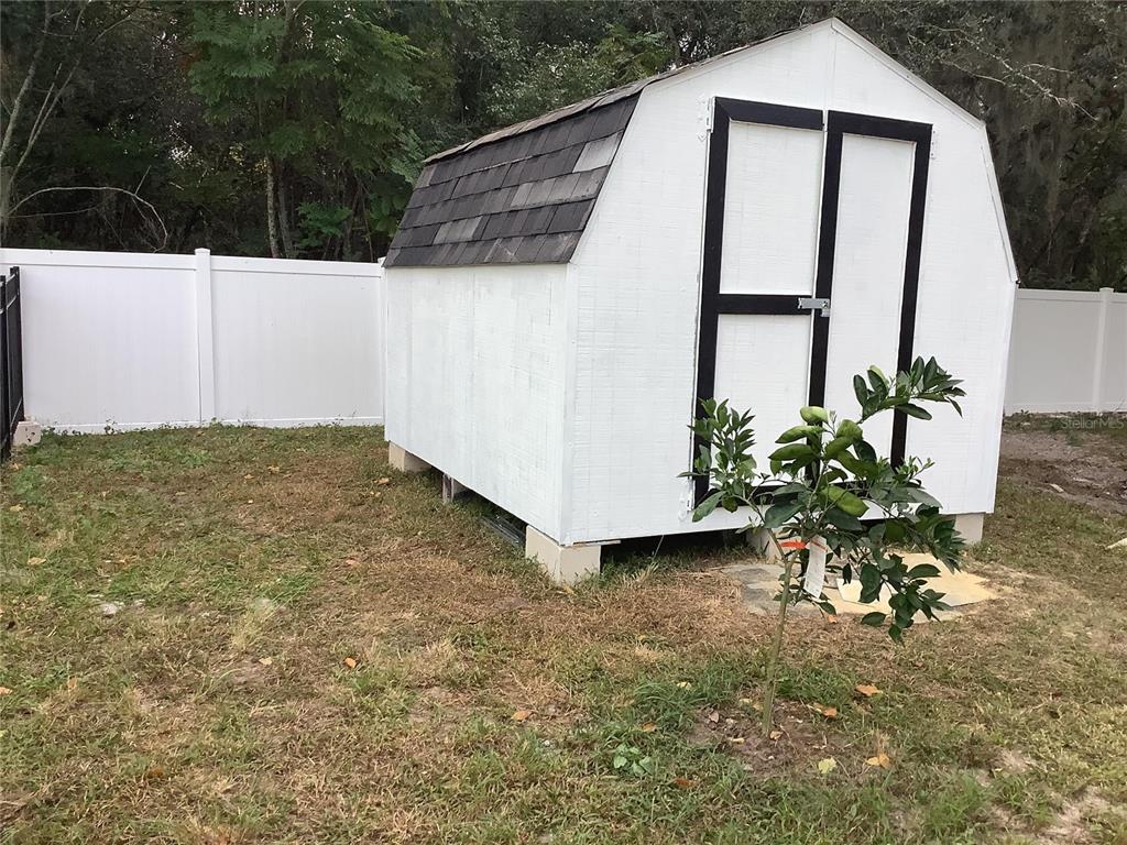 1150 North Dean Road Orlando, FL 32825 - Photo 8 of 16 a view of a house with backyard and sitting area