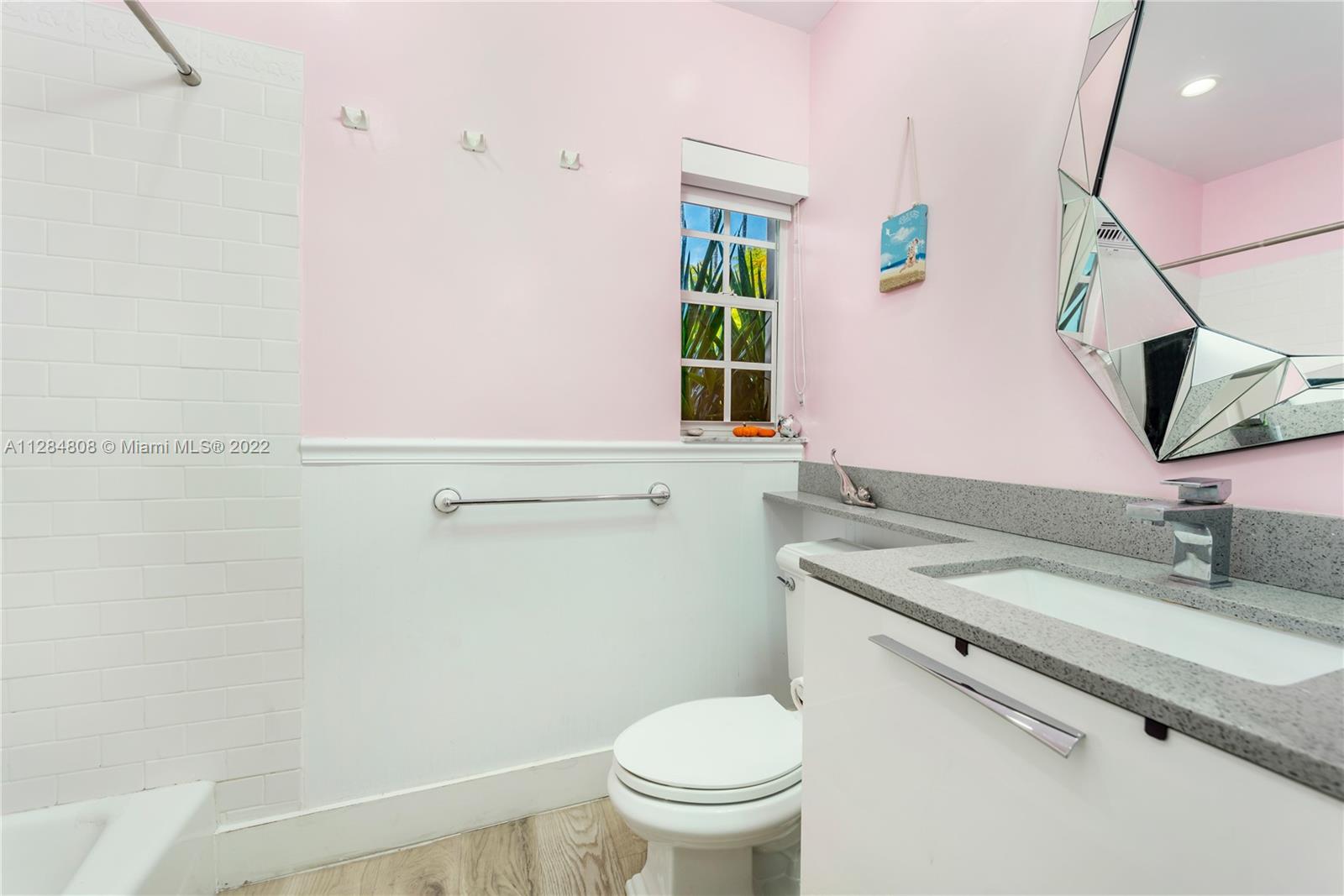 749 Ridgewood Road Key Biscayne, FL 33149 - Photo 21 of 34 a bathroom with a granite countertop sink and a mirror