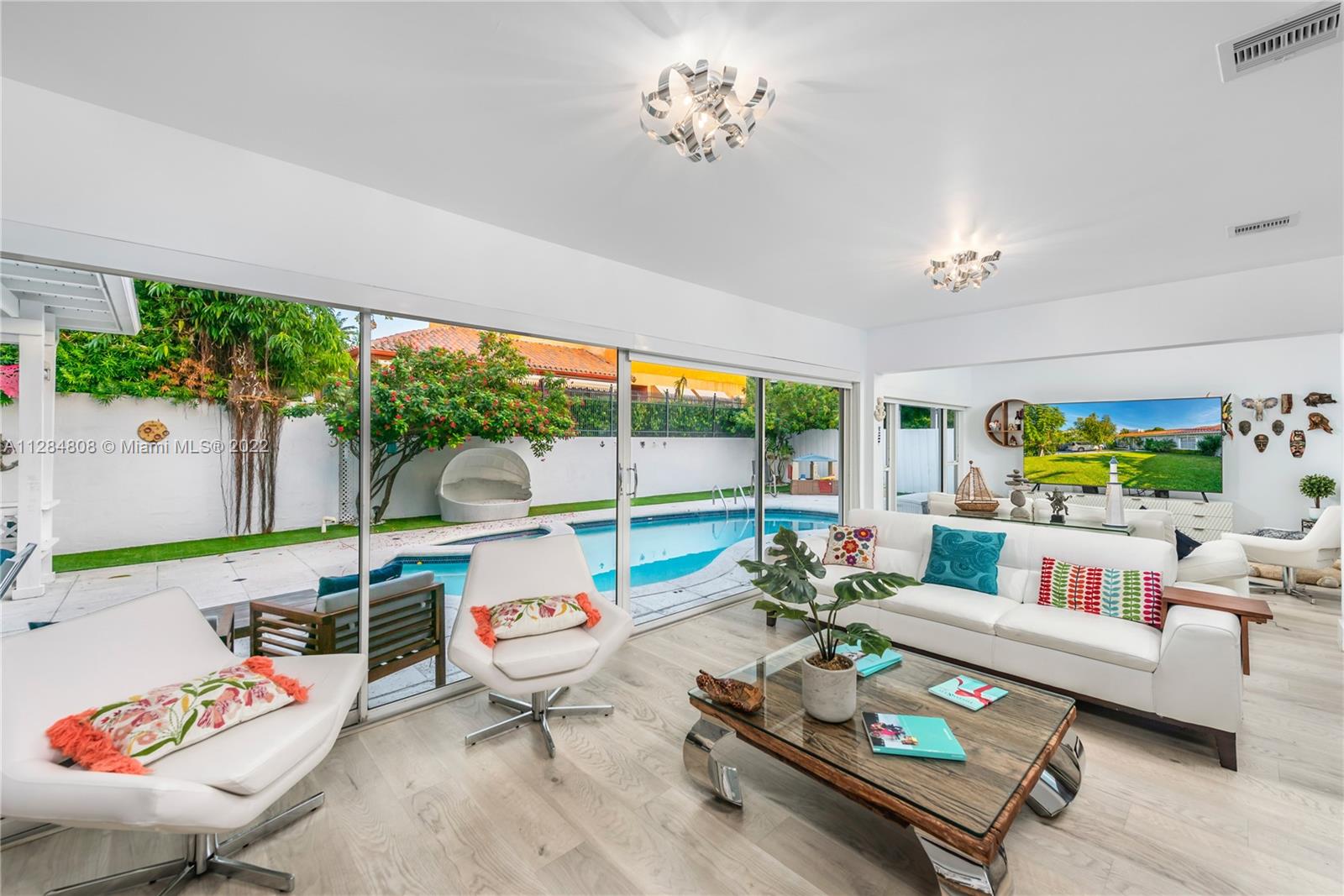 749 Ridgewood Road Key Biscayne, FL 33149 - Photo 3 of 34 a living room with furniture and a large window