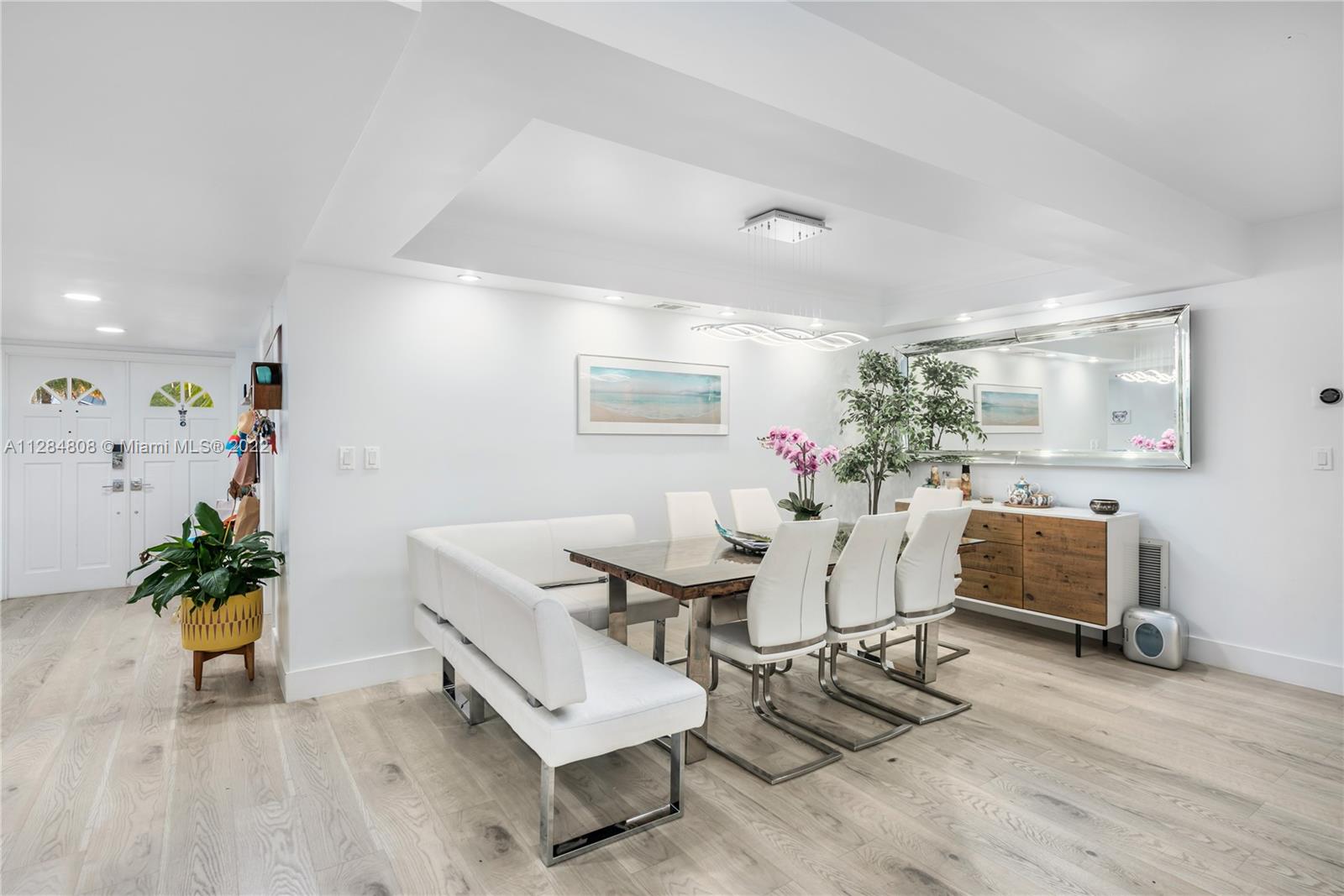 749 Ridgewood Road Key Biscayne, FL 33149 - Photo 5 of 34 a living room with furniture and flowers