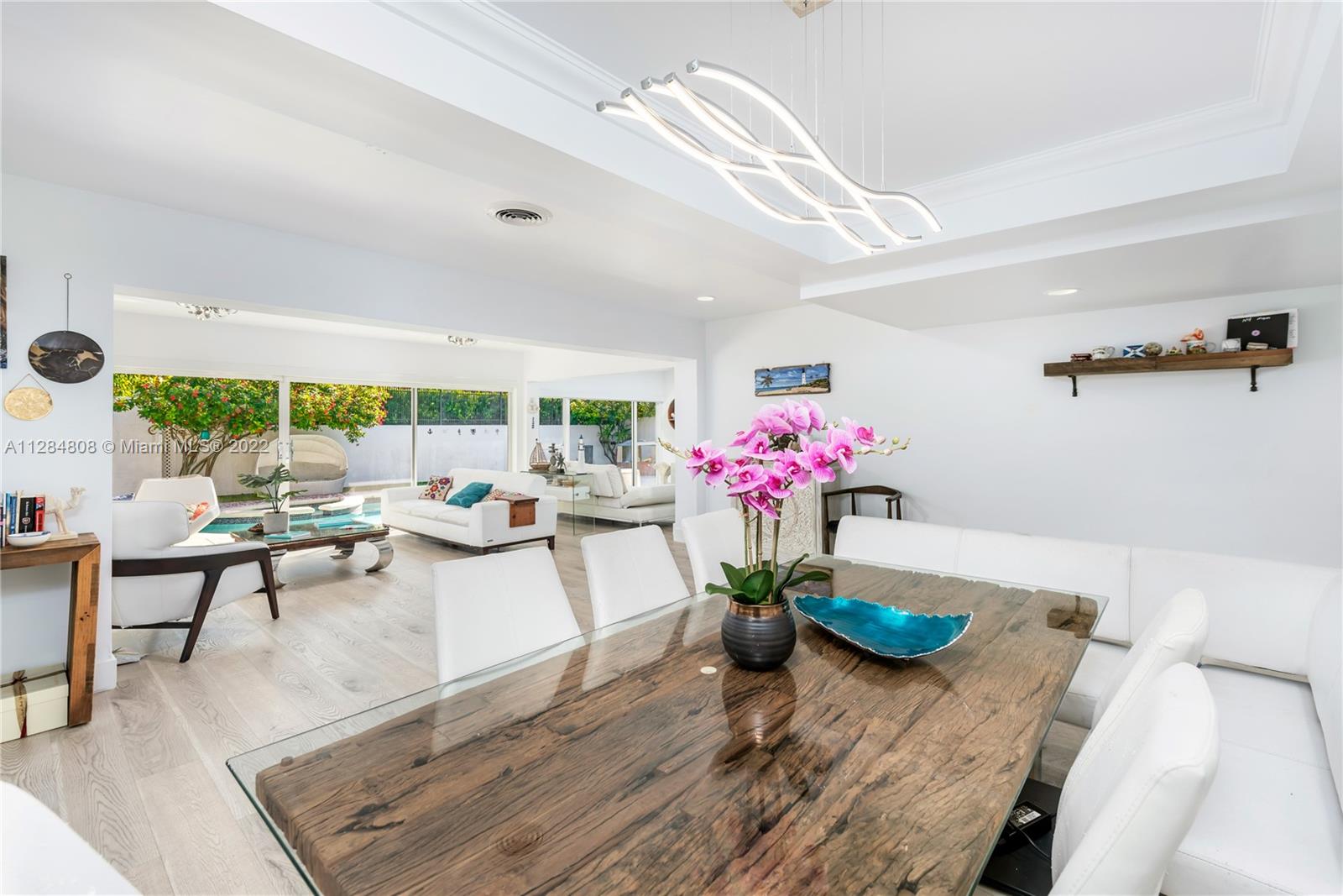 749 Ridgewood Road Key Biscayne, FL 33149 - Photo 6 of 34 a living room with furniture and flowers