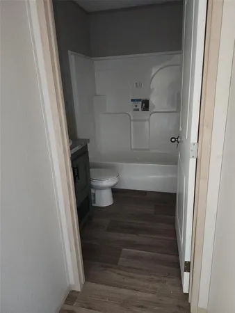 a bathroom with a sink and toilet