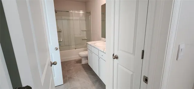 a bathroom with white walls