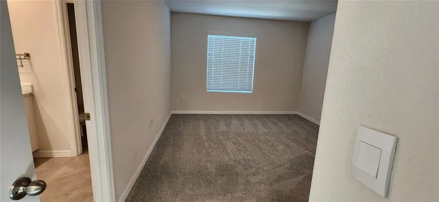 a view of a hallway with front door