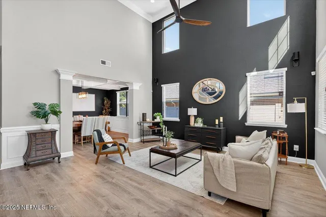 an open kitchen with granite countertop wooden floor cabinets and stainless steel appliances