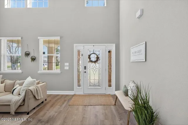 a kitchen with granite countertop stainless steel appliances a stove sink and cabinets