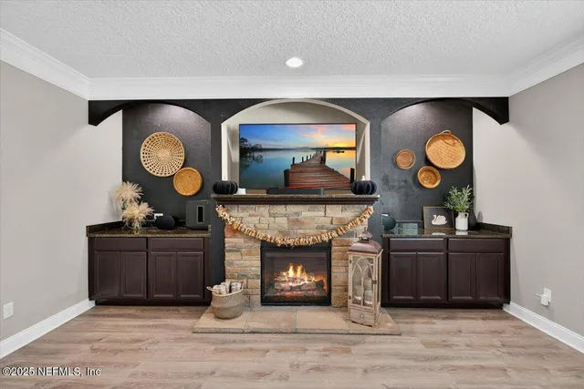 a living room with a bed furniture and a window