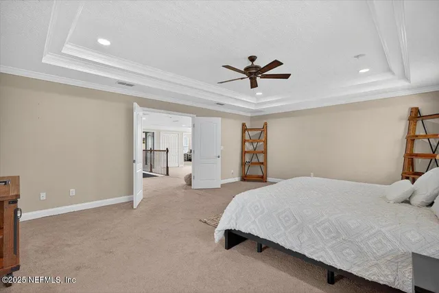 a view of an empty room with a window and a flat screen tv