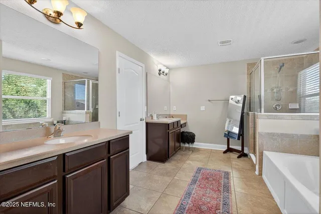a living room with furniture and a ceiling fan
