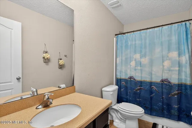 a balcony with furniture and a garden