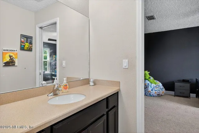 an aerial view of residential houses with outdoor space and city view