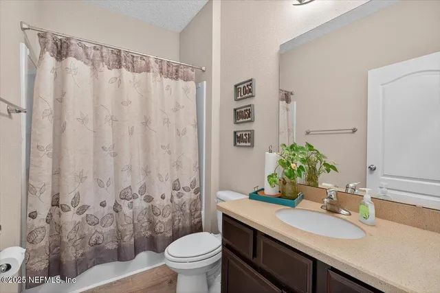a view of a patio with table and chairs