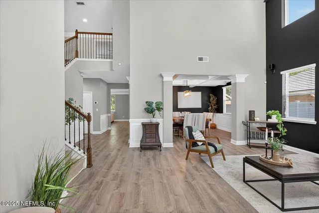 a dining room with furniture and window