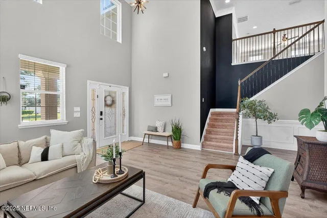 a kitchen with stainless steel appliances kitchen island granite countertop a refrigerator and a stove top oven