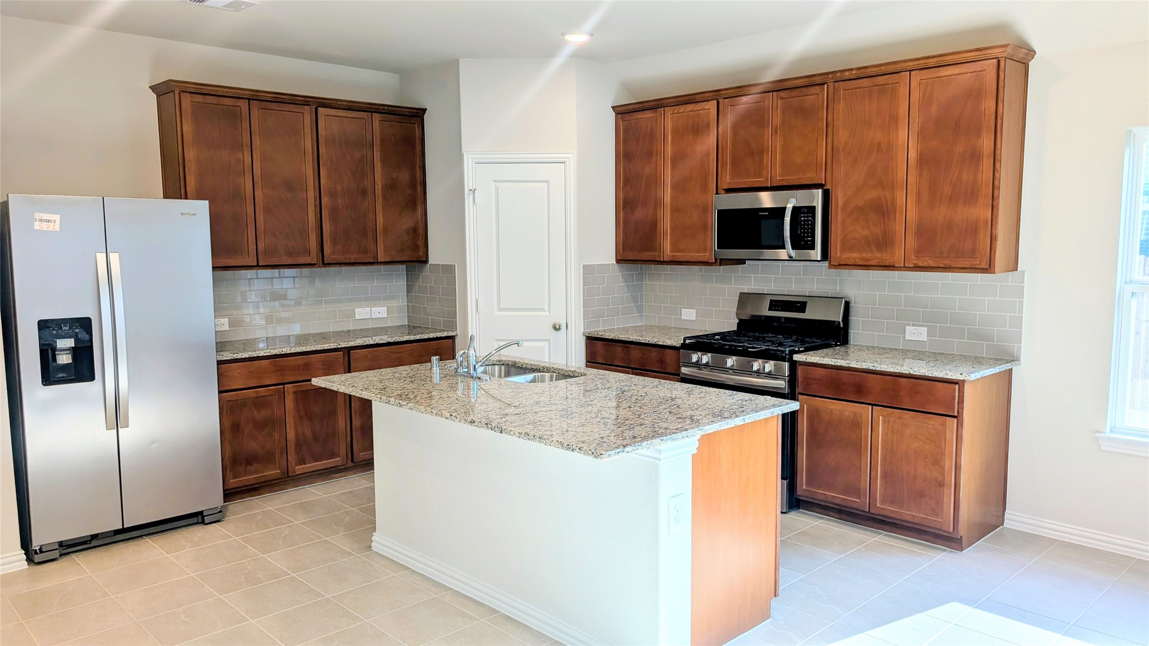 32314 Mimosa Ridge Lane Waller, TX 77484 - Photo 8 of 16 a kitchen with stainless steel appliances granite countertop a refrigerator stove a sink and dishwasher