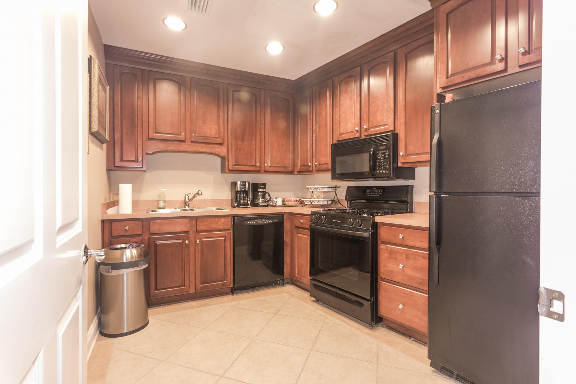 56 Blue Mountain Road, Unit B303 Santa Rosa Beach, FL 32459 - Photo 43 of 47 a kitchen with stainless steel appliances granite countertop a refrigerator stove top oven and sink