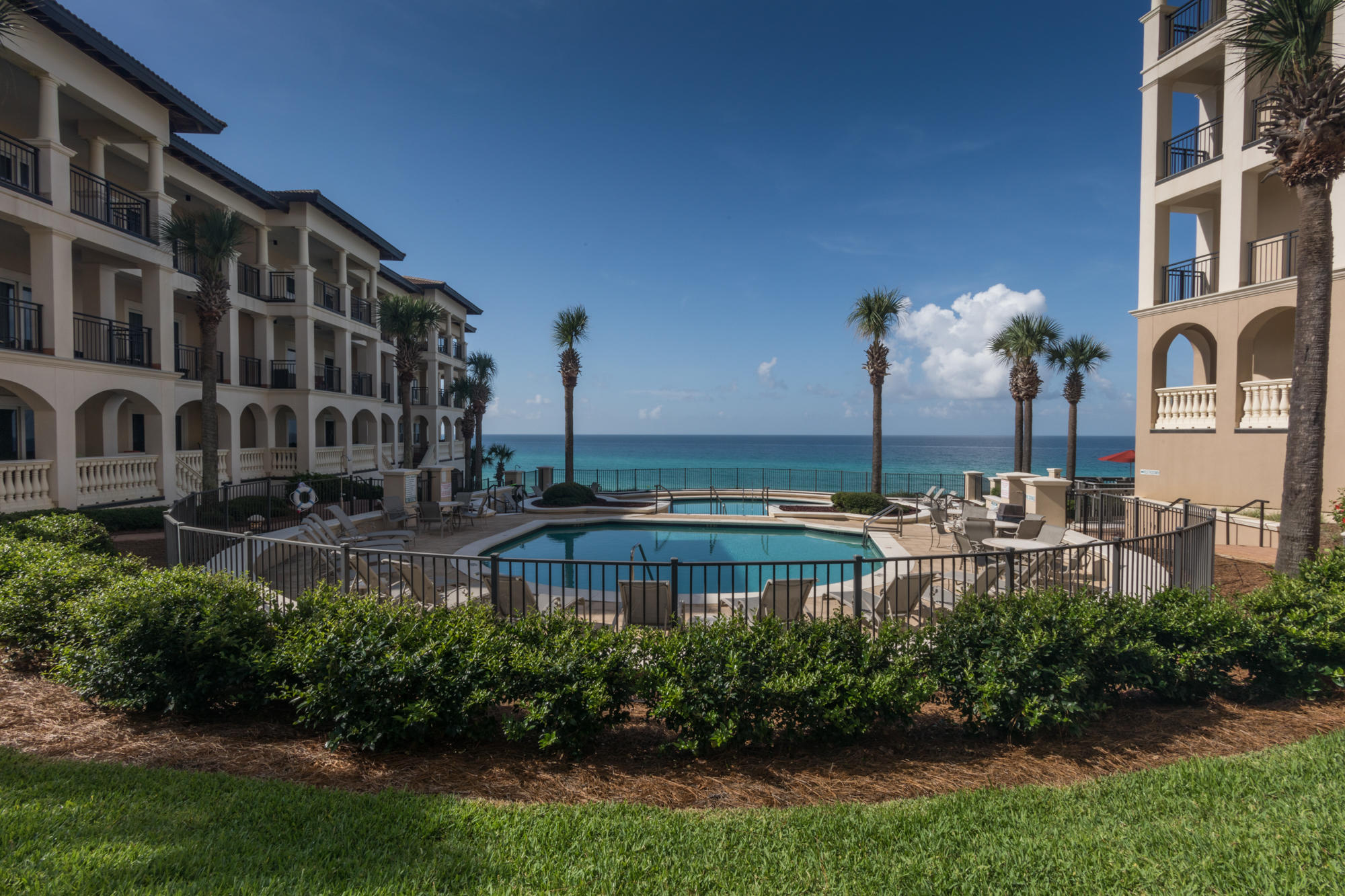 56 Blue Mountain Road, Unit B303 Santa Rosa Beach, FL 32459 - Photo 9 of 47 a view of a building with garden and sitting area