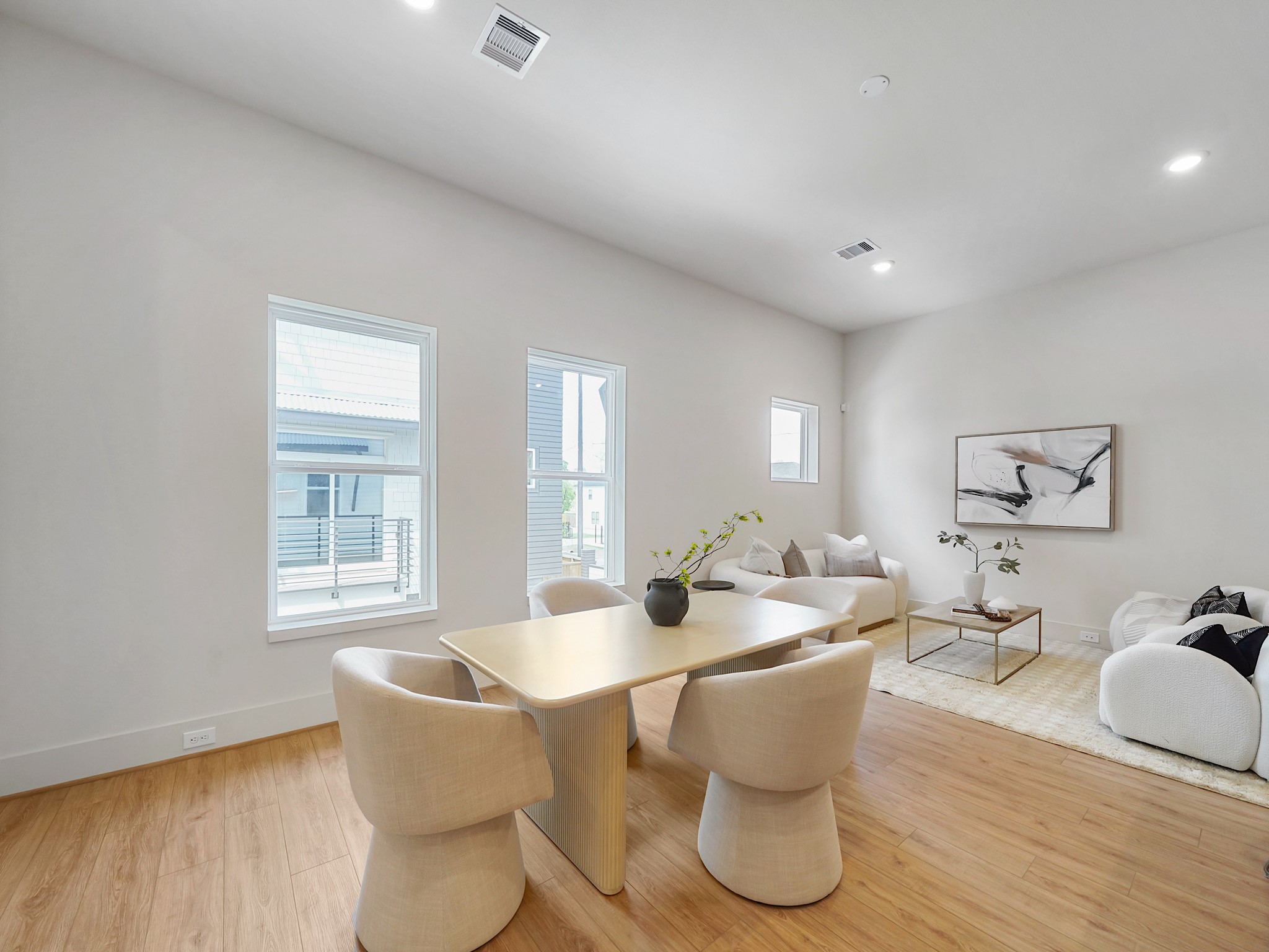 861 Rachel Street, Unit E Houston, TX 77091 - Photo 9 of 29 Discover seamless living with this inviting dining area, effortlessly blending into the open kitchen and cozy living space, perfect for entertaining and everyday comfort.