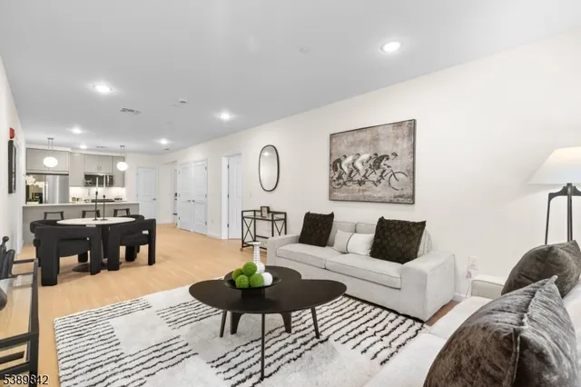 a living room with furniture and a table