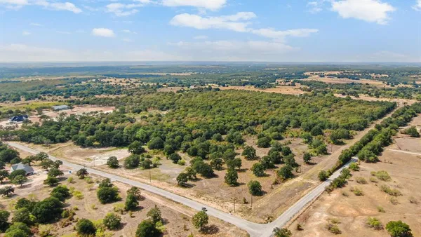 a view of outdoor space with trees all around