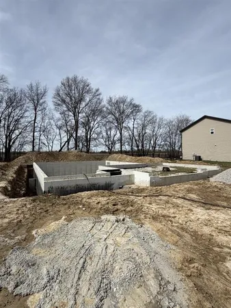 a view of yard with large trees