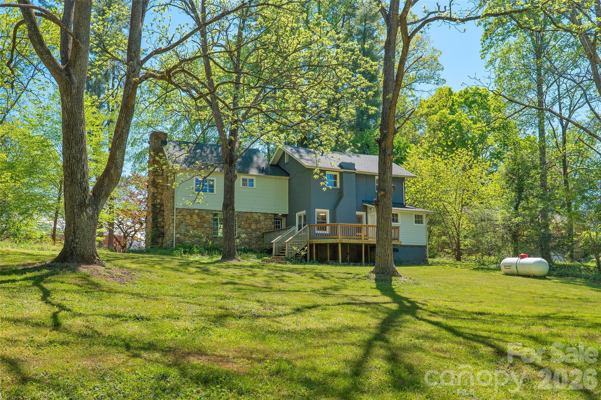 112 Candler School Road Candler, NC 28715 - Photo 22 of 37 a view of a house with backyard and sitting area