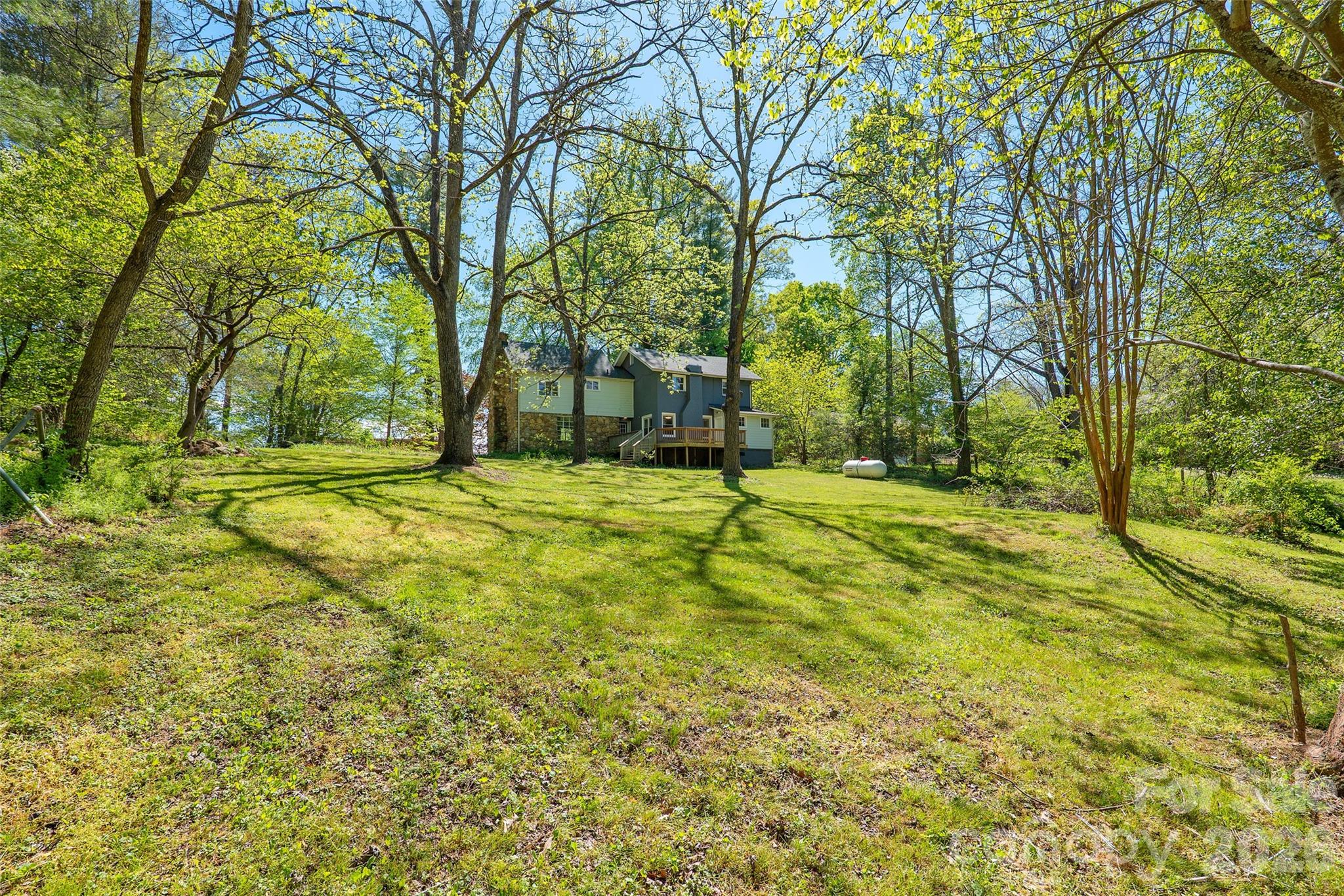 112 Candler School Road Candler, NC 28715 - Photo 23 of 37 a swimming pool with trees in front of it