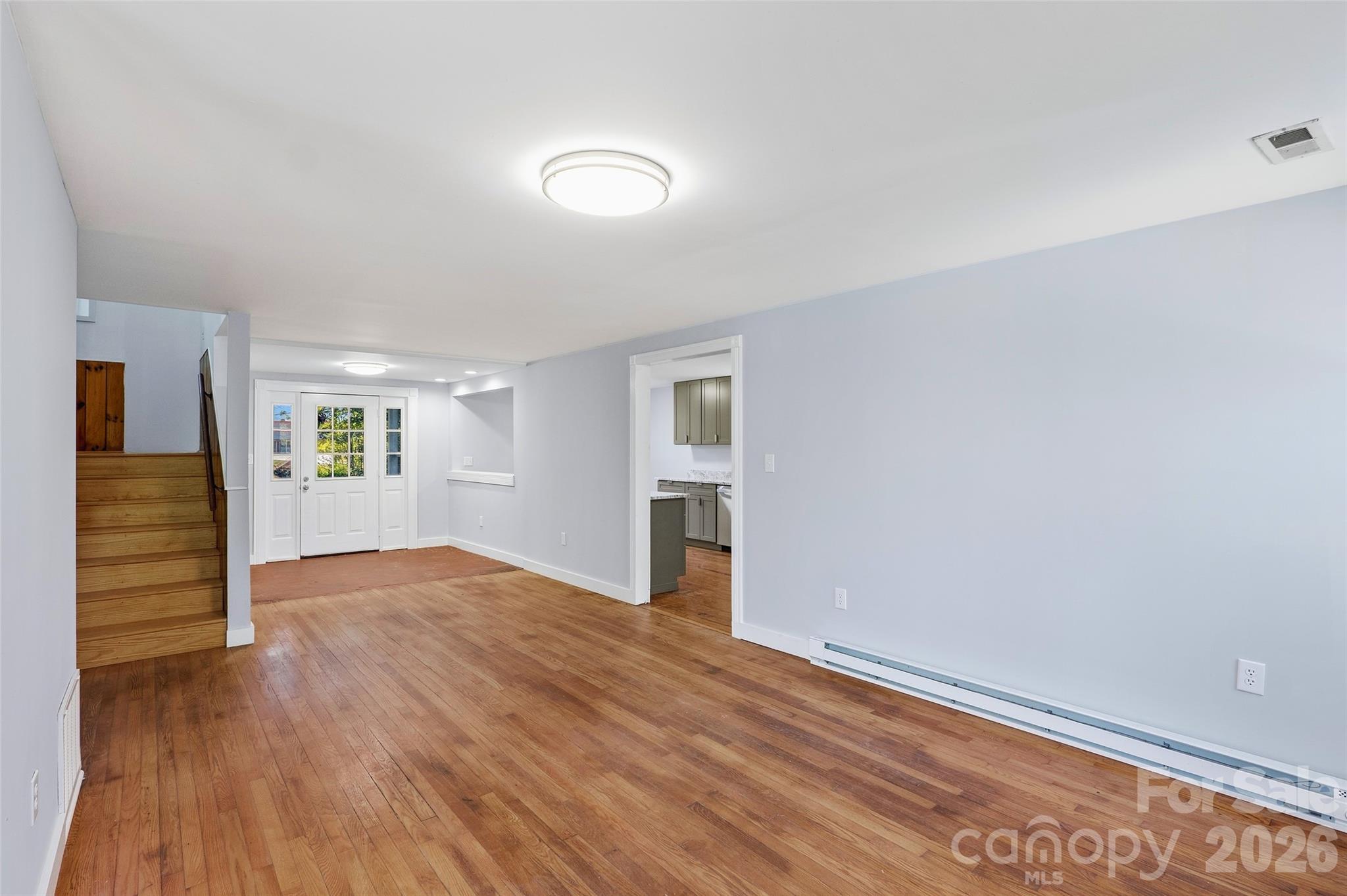 112 Candler School Road Candler, NC 28715 - Photo 24 of 37 wooden floor in an empty room with a window