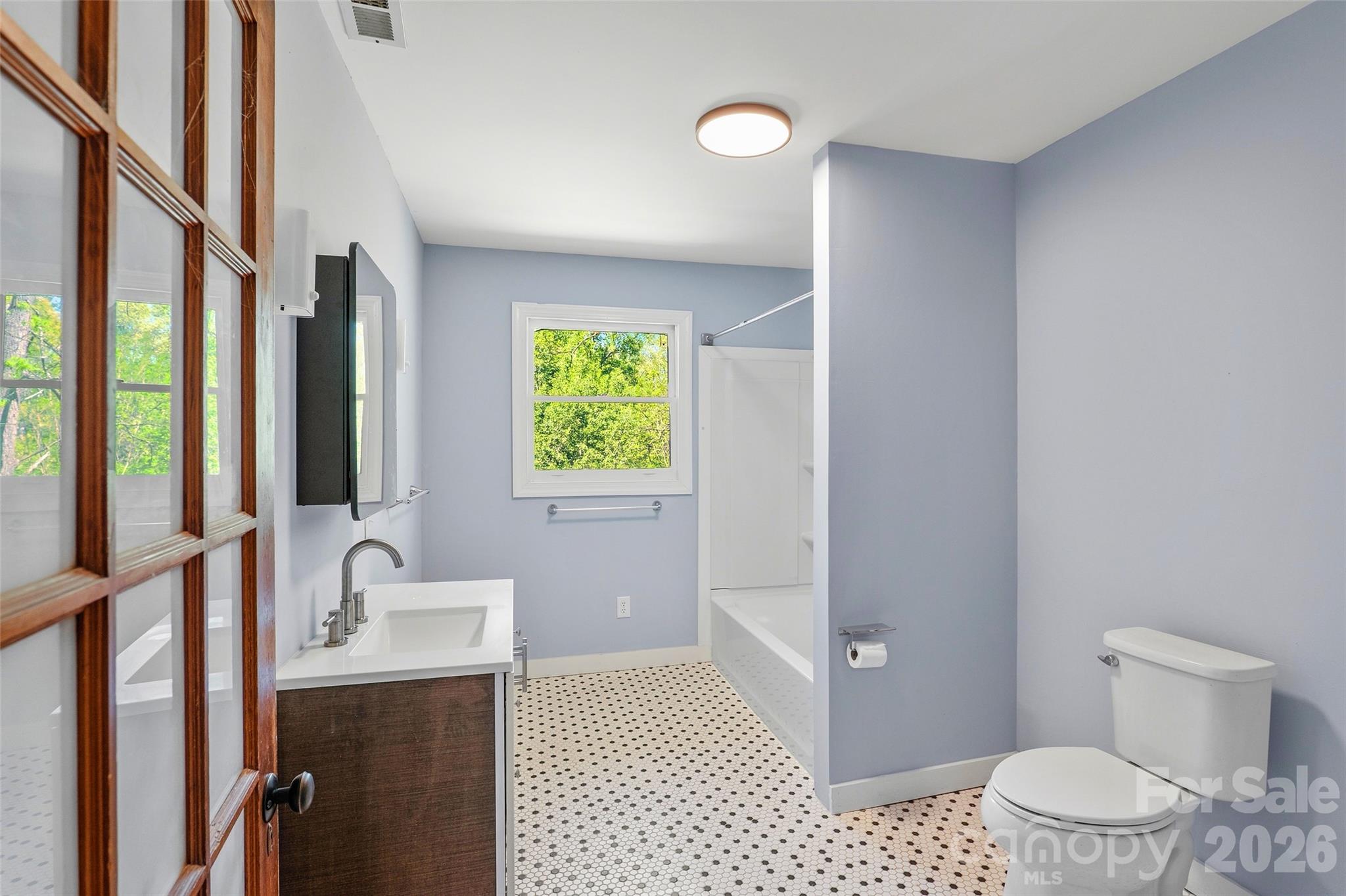 112 Candler School Road Candler, NC 28715 - Photo 26 of 37 a bathroom with a sink a toilet and shower
