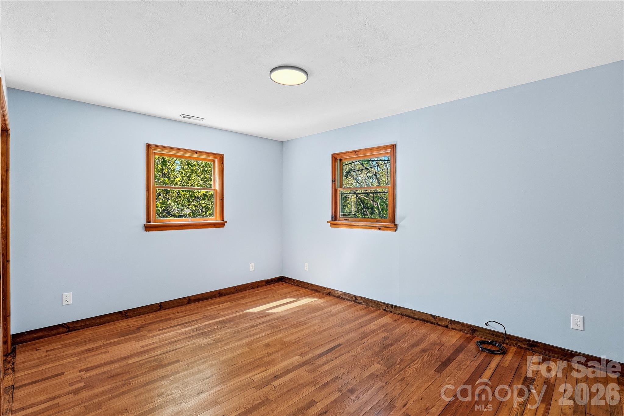 112 Candler School Road Candler, NC 28715 - Photo 32 of 37 a view of empty room with wooden floor