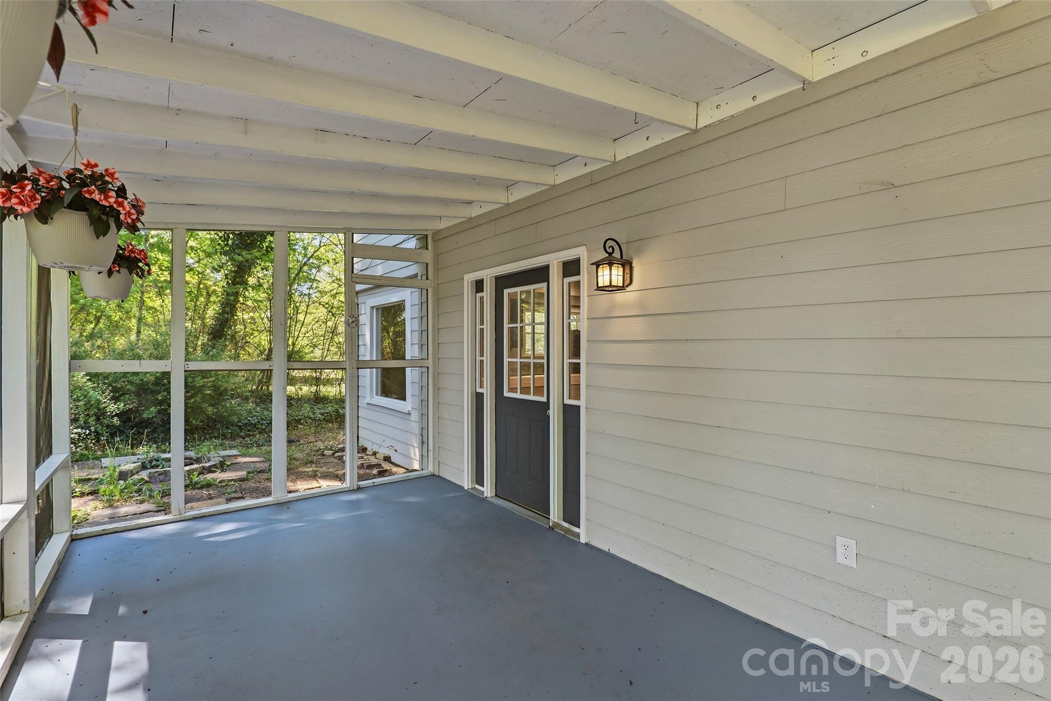 112 Candler School Road Candler, NC 28715 - Photo 6 of 37 a view of a porch with wooden floor and garden space