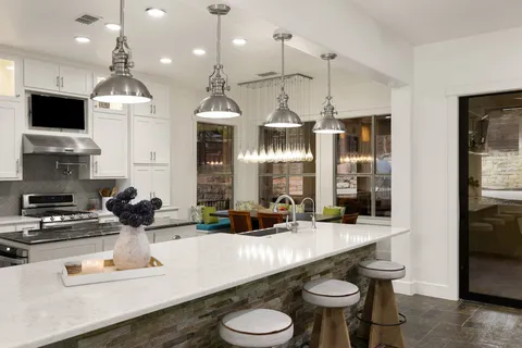 a kitchen with sink and refrigerator