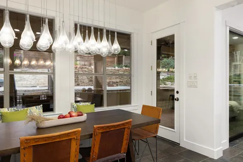 a kitchen with a table and chairs