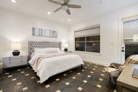 a bedroom with a bed and window