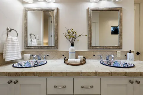 a bathroom with sink and mirror