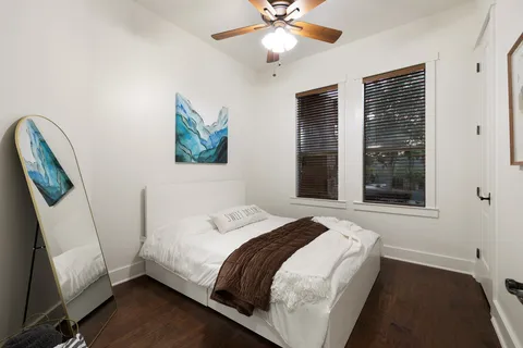 a bedroom with a bed and a window