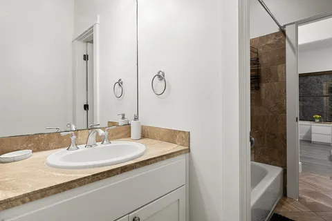 a bathroom with a sink and a mirror